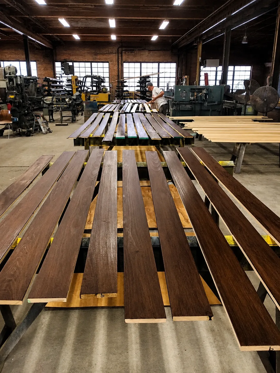 Commercial workspace with repeated wood components being finished