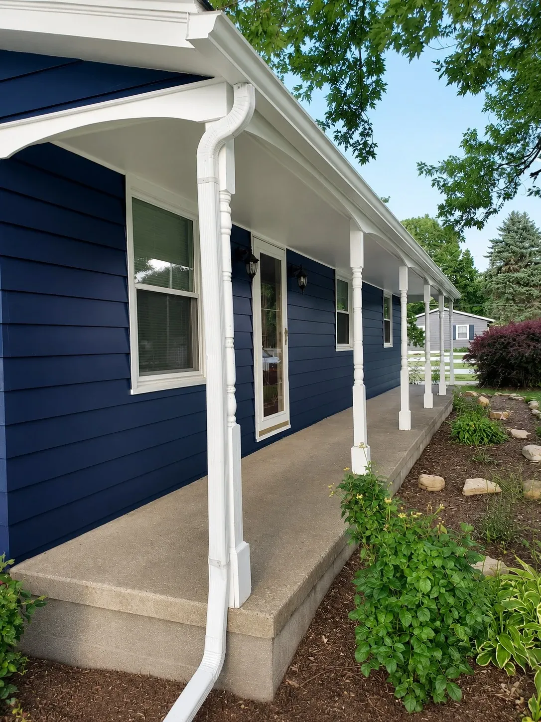 Blue painted residential exterior with white trim