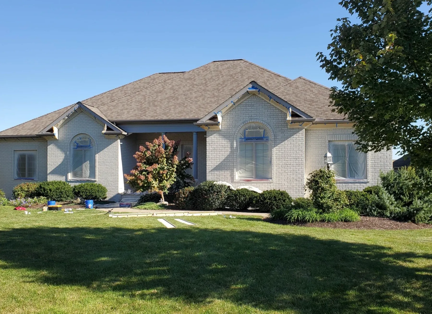 Light neutral residential exterior with white trim