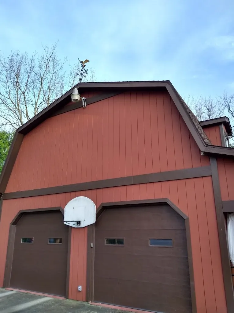 Rust red and dark brown painted garage exterior